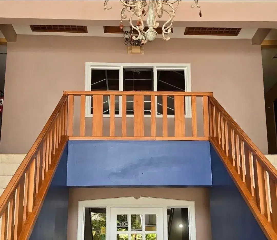 Timber staircase and chandelier in the entrance hall
