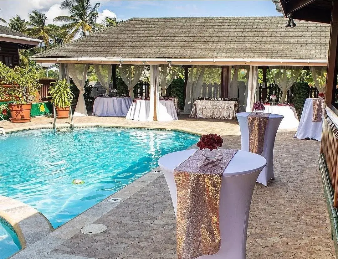 Poolside pavilion dressed for a wedding celebration