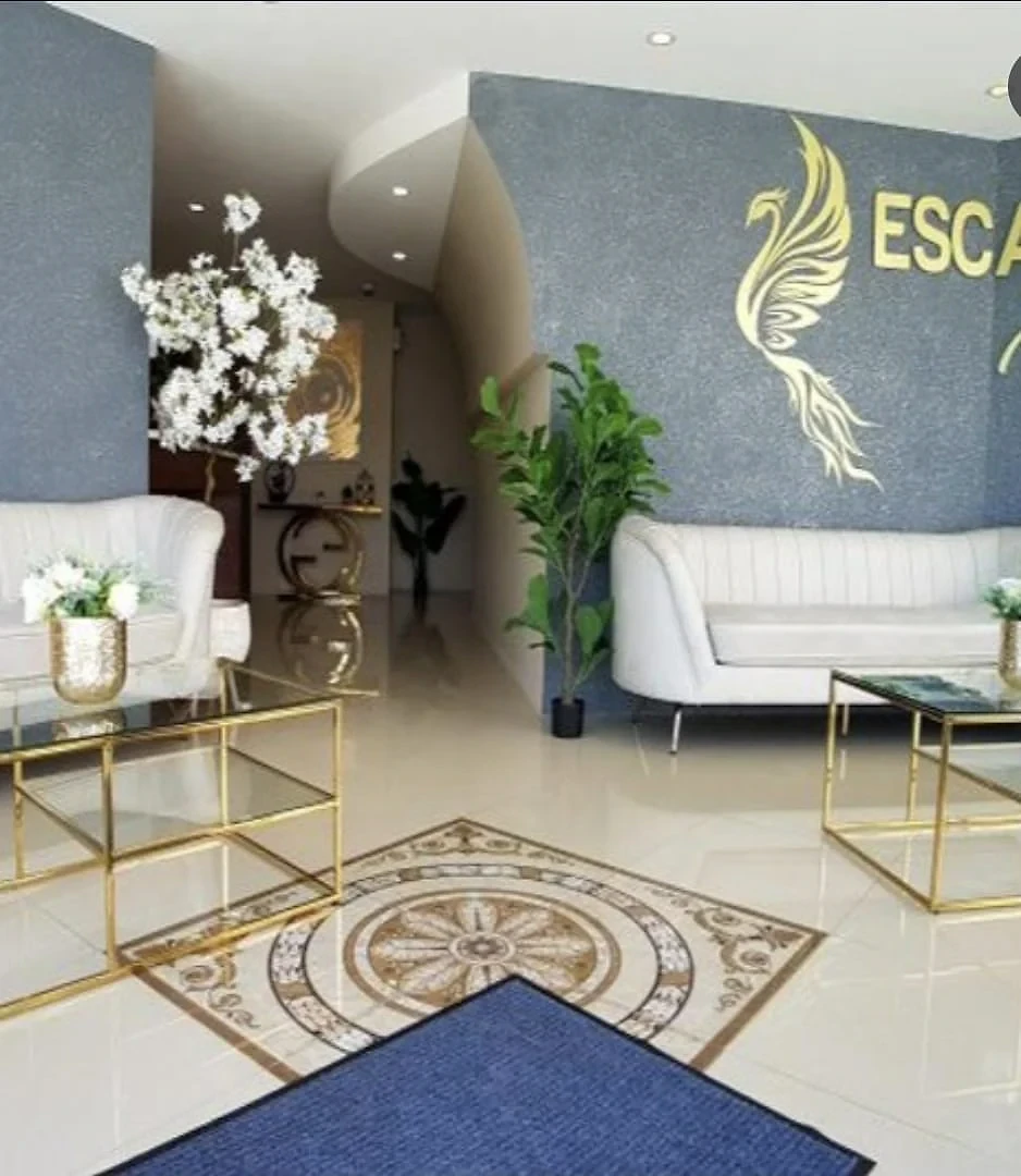 Lobby entrance decorated with Escarlet Hotel phoenix branding