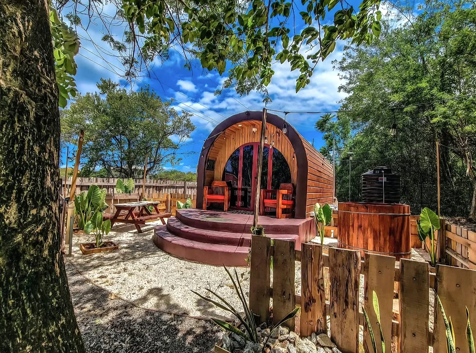 Glampedd pod cabin and timber deck in daylight