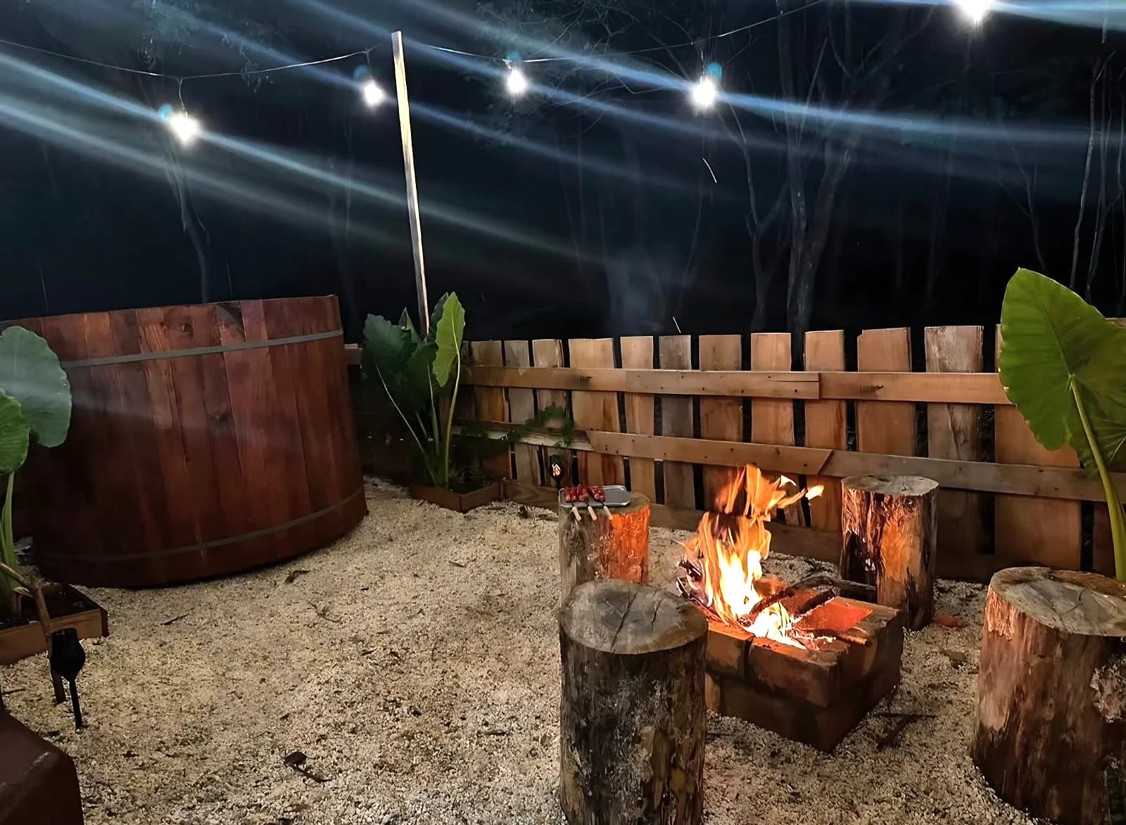 Outdoor firepit seating beside the Glampedd pod