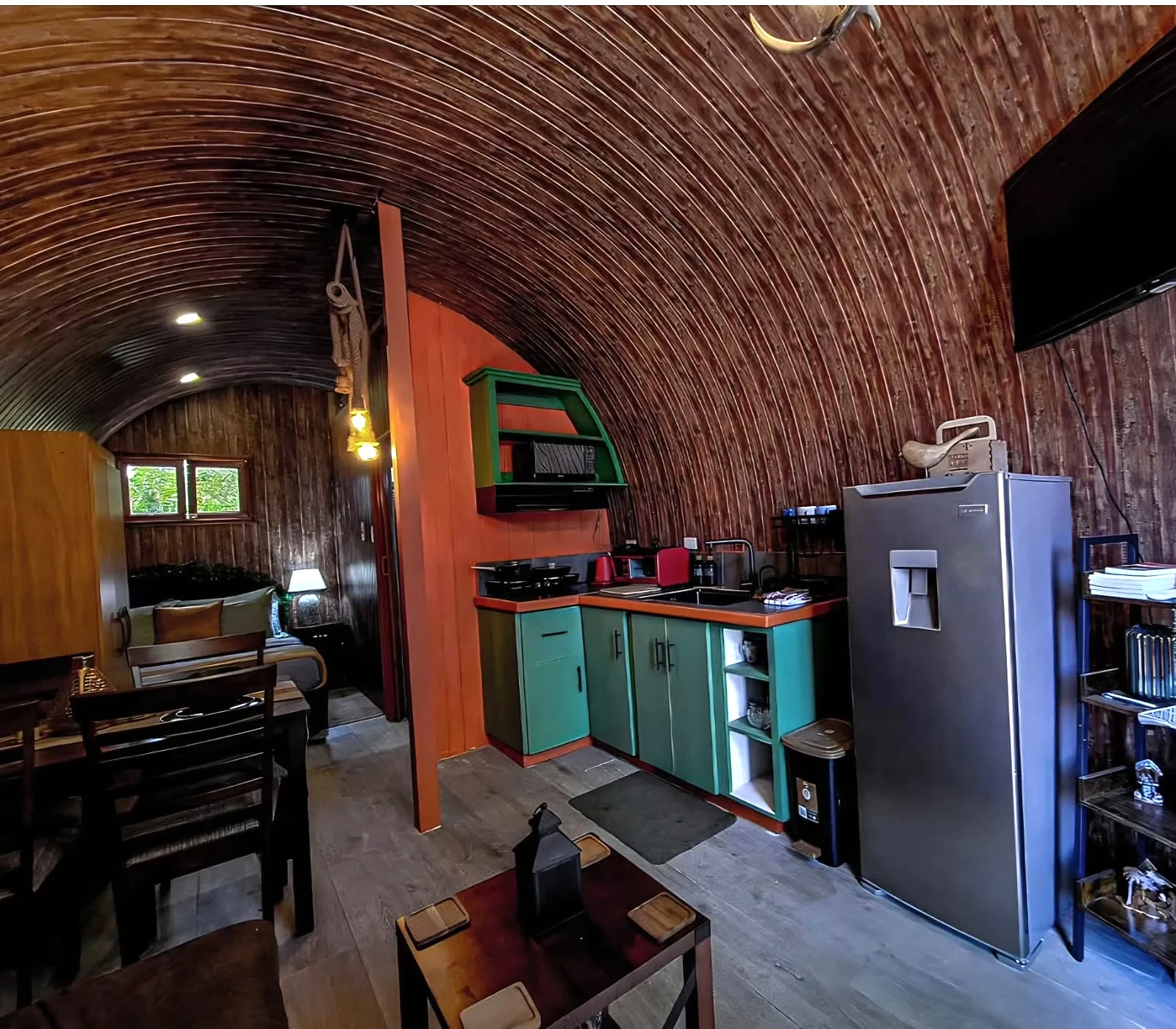 Compact timber kitchenette inside Glampedd