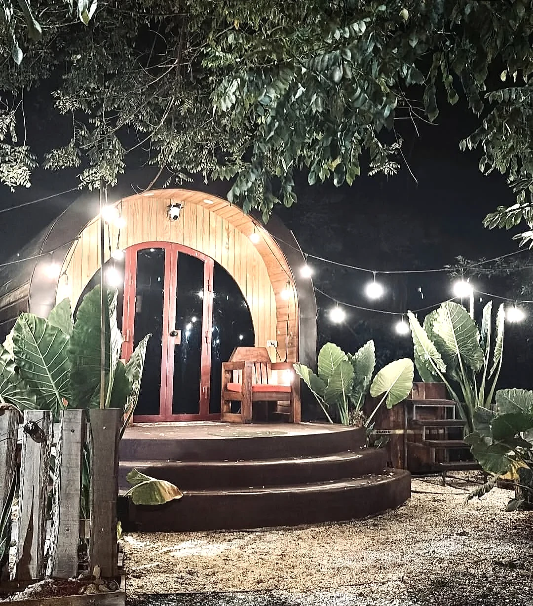 Glampedd pod glowing beneath the night sky