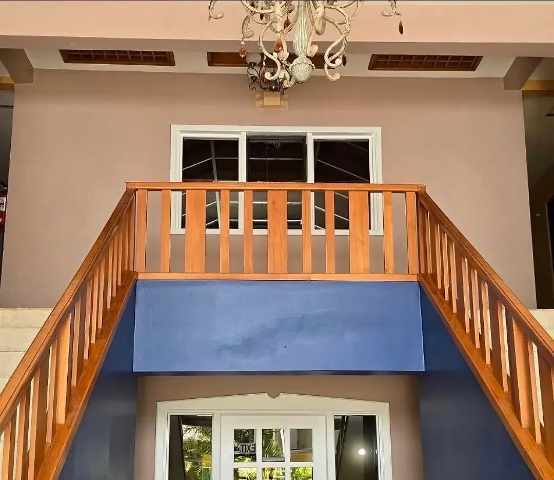 Timber staircase and chandelier in the entrance hall