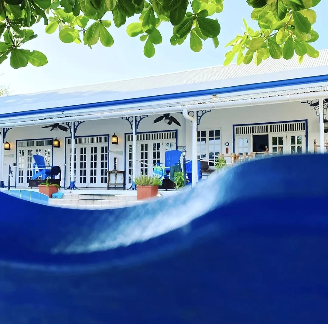 Shaded veranda beside the Sapodilla Villa pool