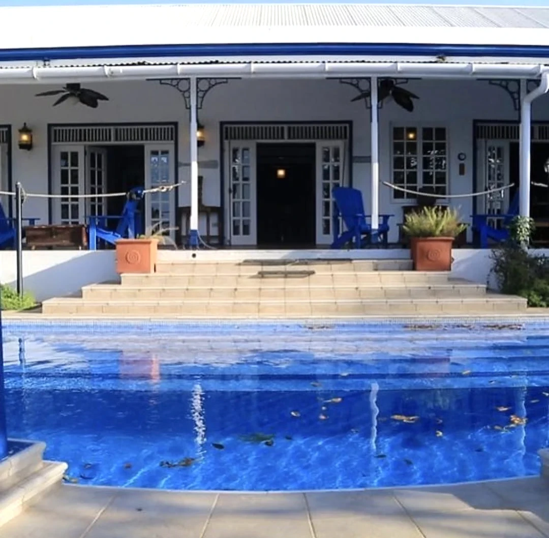 Villa entrance opening onto the pool terrace