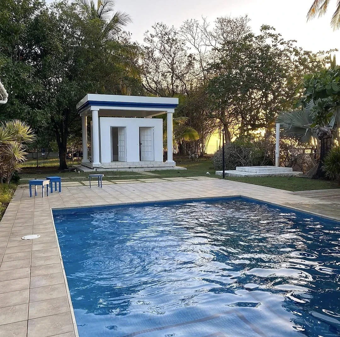 Pool and gazebo at sunset at Sapodilla Villa