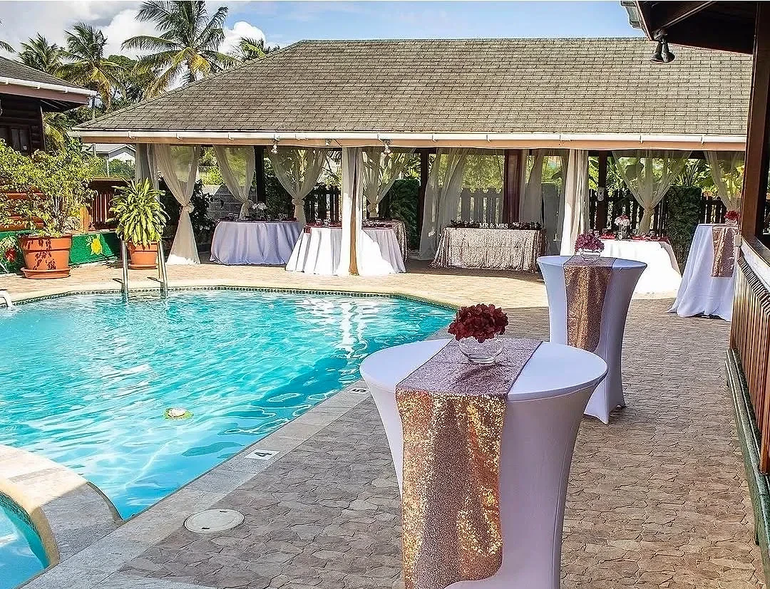 Poolside pavilion dressed for a wedding celebration